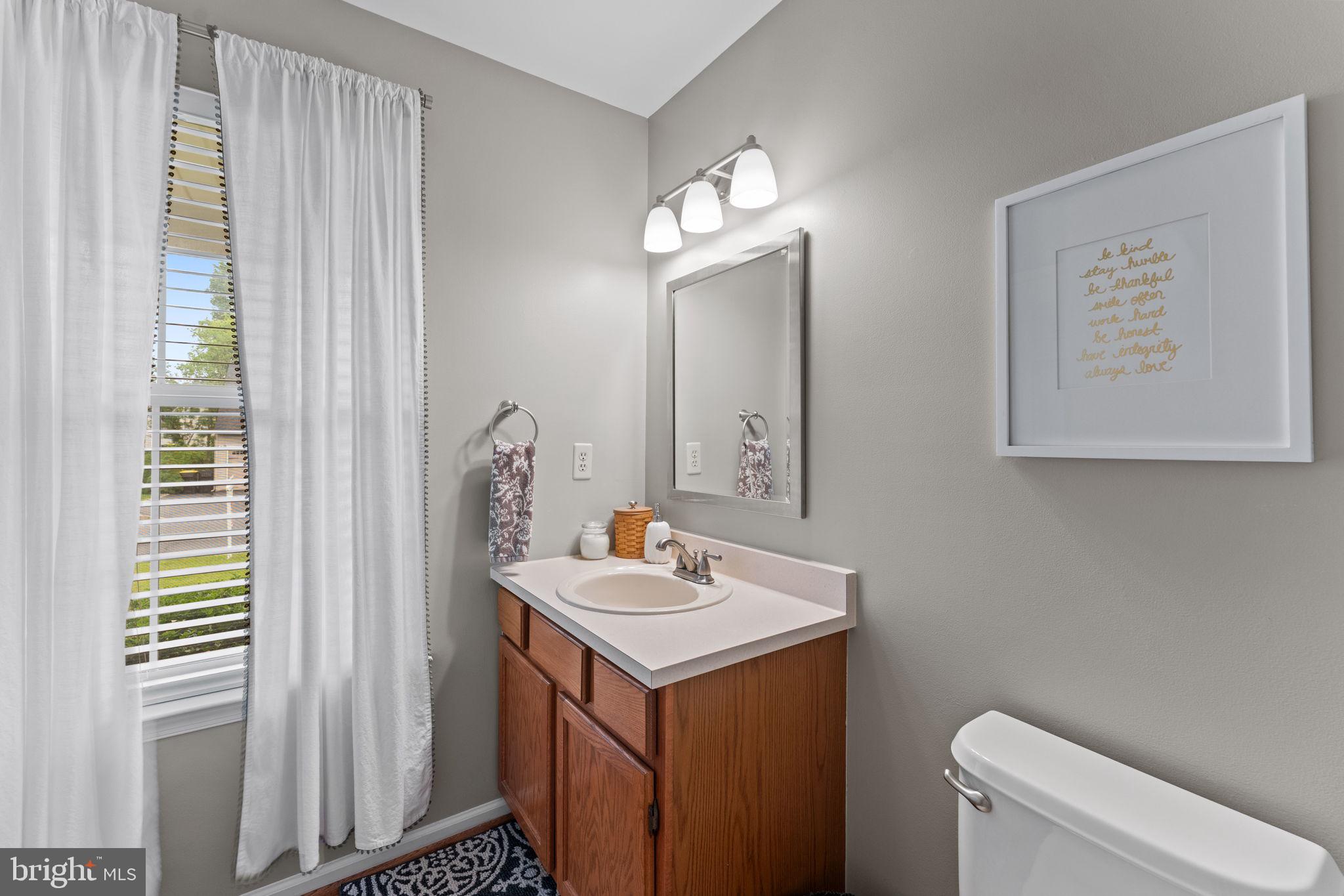 803 Red Coat Road Collegeville, PA 19426 - Photo 16 of 33 a bathroom with a toilet sink and mirror