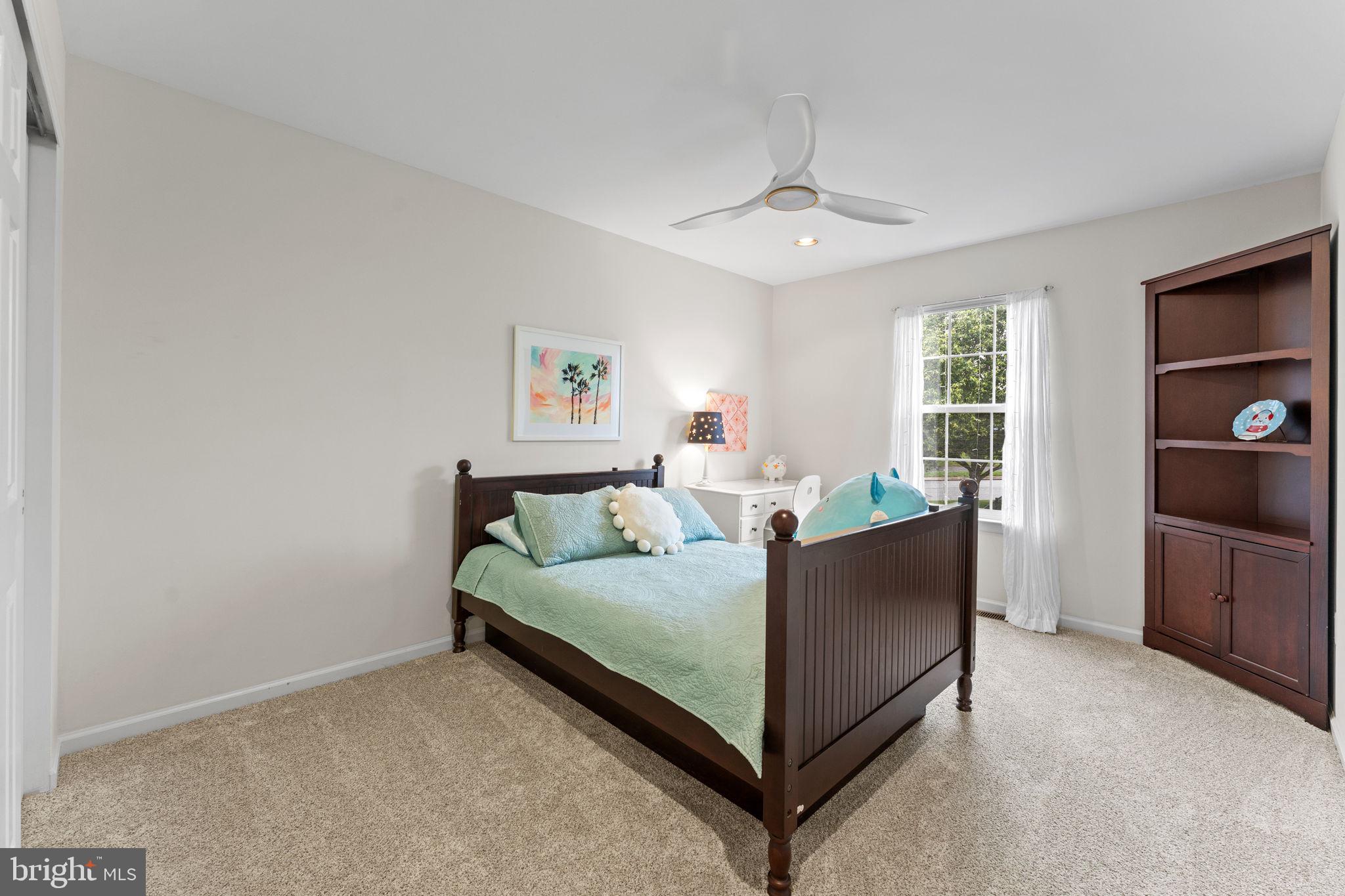 803 Red Coat Road Collegeville, PA 19426 - Photo 22 of 33 a living room with a bed furniture and a flat tv screen
