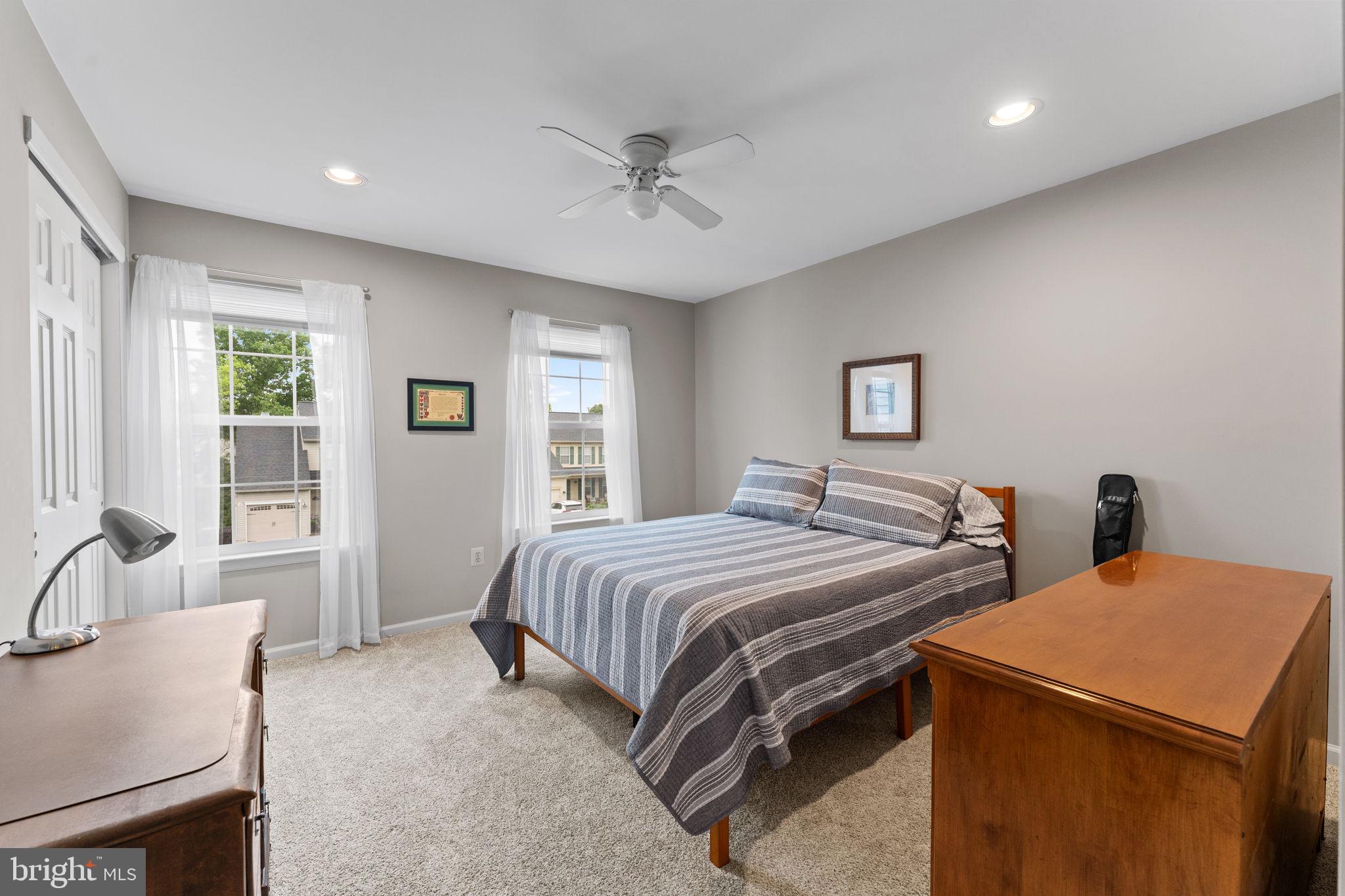 803 Red Coat Road Collegeville, PA 19426 - Photo 24 of 33 a bedroom with a bed and a chandelier