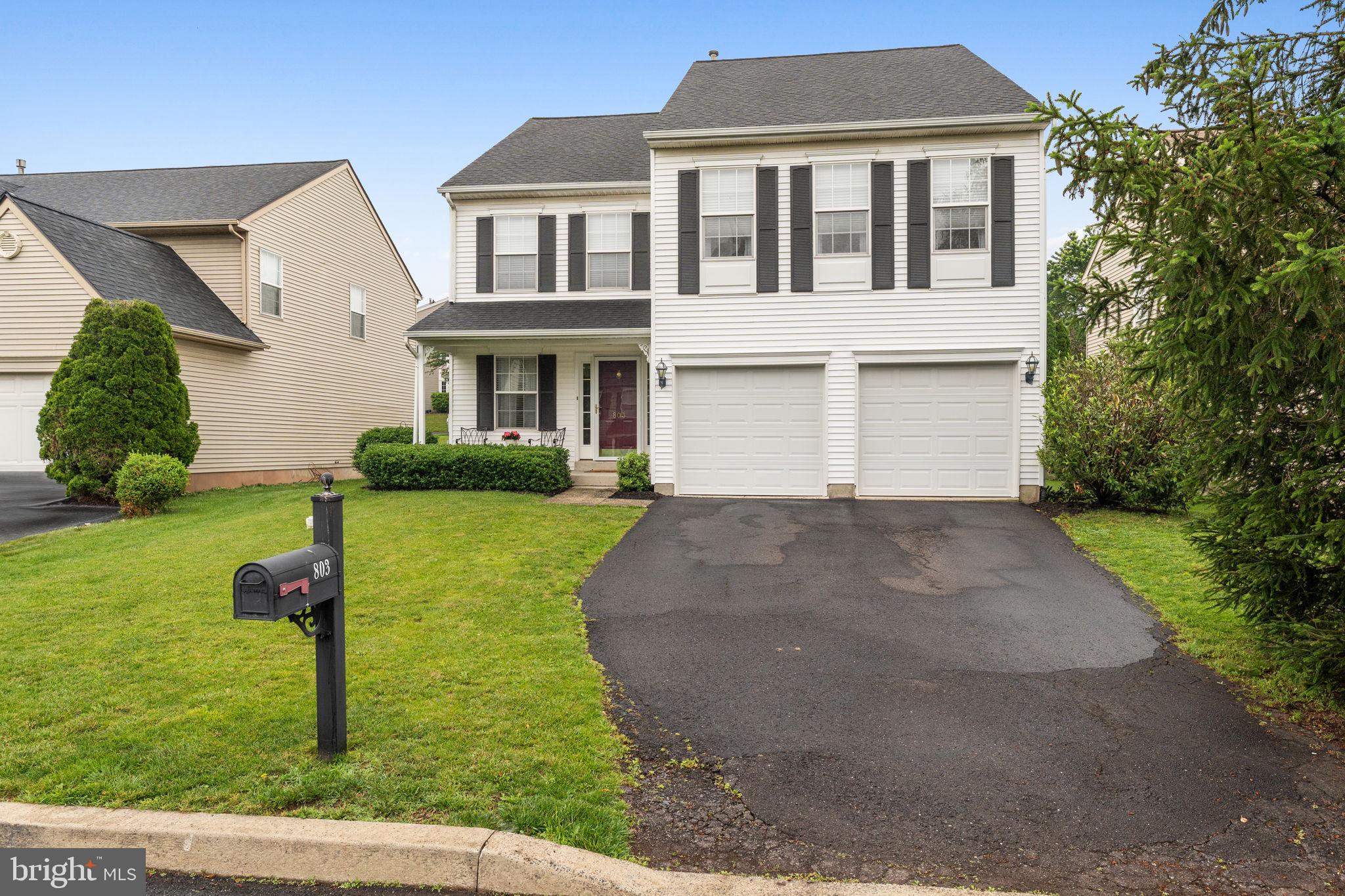 803 Red Coat Road Collegeville, PA 19426 - Photo 3 of 33 a front view of a house with garden