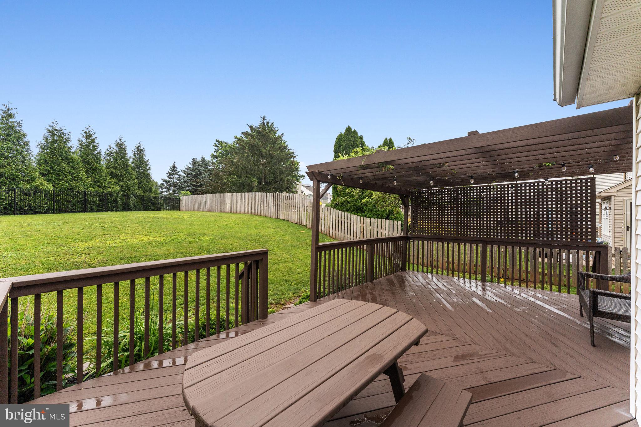 803 Red Coat Road Collegeville, PA 19426 - Photo 31 of 33 a view of a wooden deck and a yard