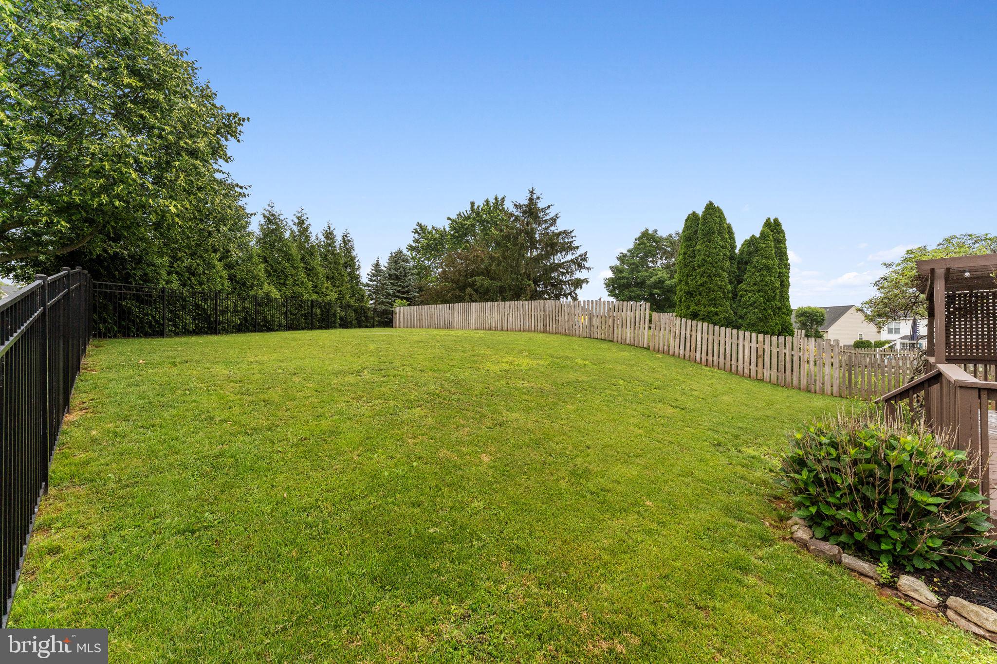 803 Red Coat Road Collegeville, PA 19426 - Photo 32 of 33 a view of yard with swimming pool and trees in the background