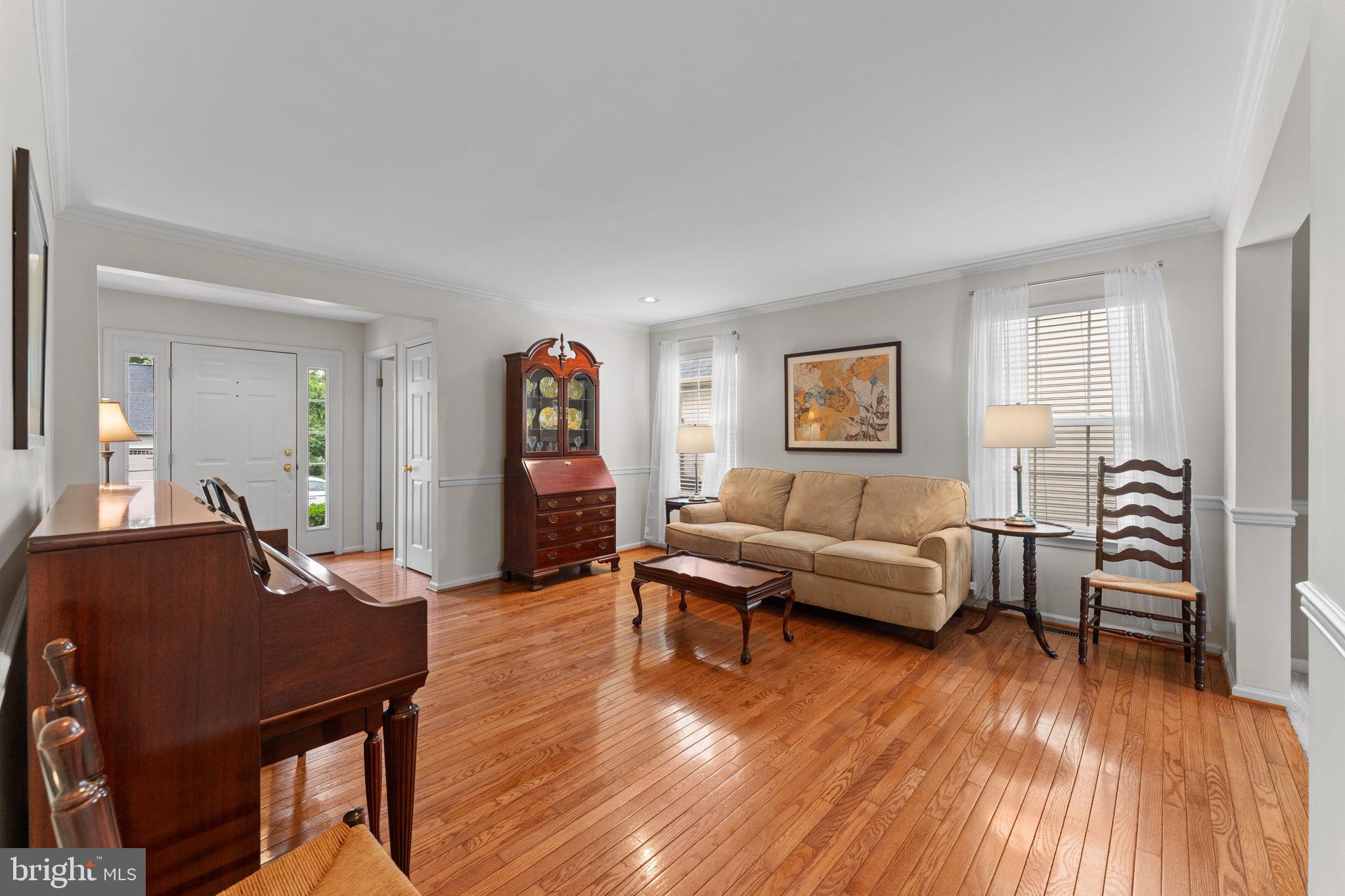803 Red Coat Road Collegeville, PA 19426 - Photo 5 of 33 a living room with furniture and a wooden floor