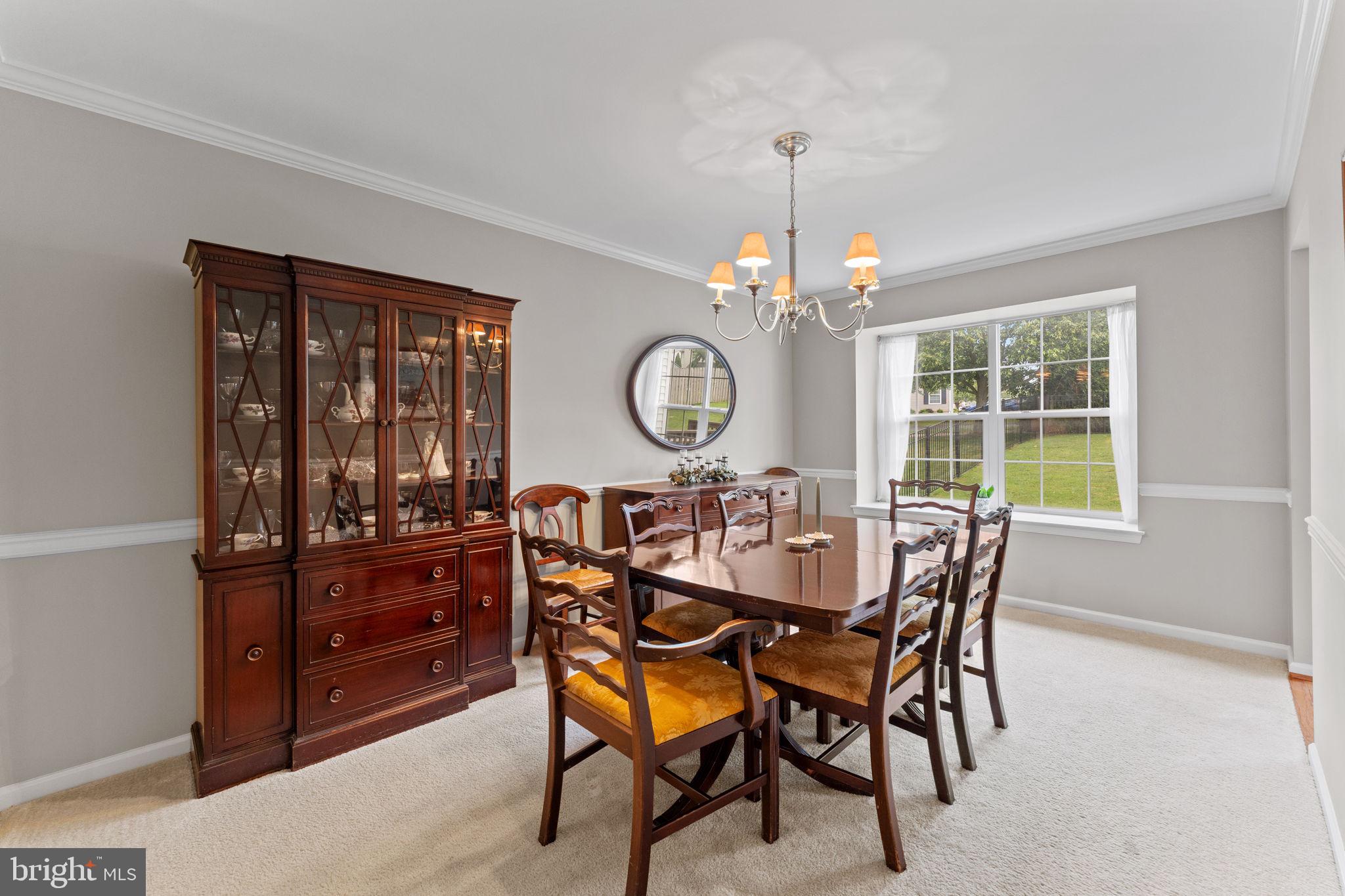 803 Red Coat Road Collegeville, PA 19426 - Photo 7 of 33 a view of a dining room with furniture and chandelier