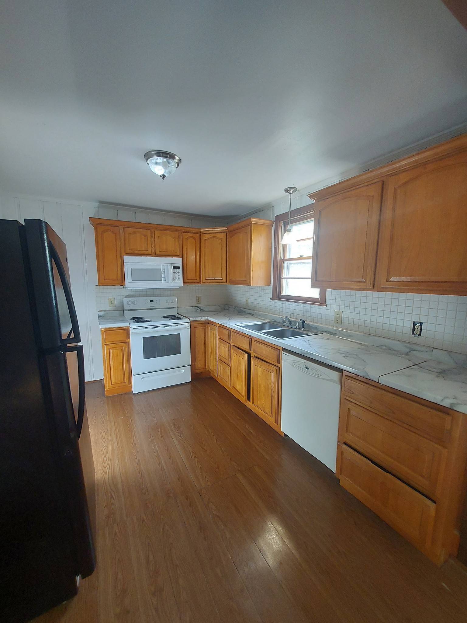 123 McKinley Street Madison, TN 37115 - Photo 11 of 11 a kitchen with stainless steel appliances granite countertop a sink stove and refrigerator