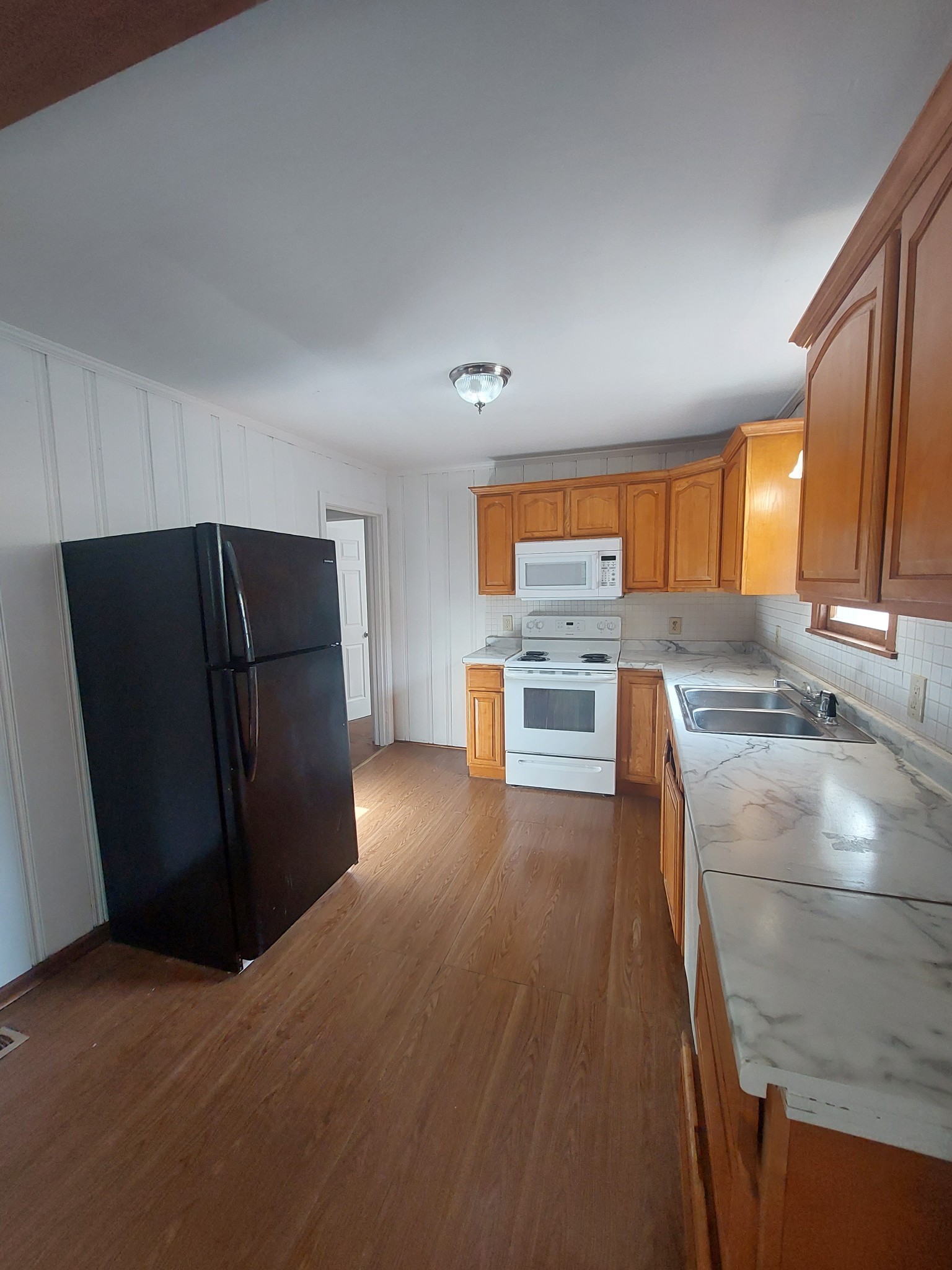 123 McKinley Street Madison, TN 37115 - Photo 6 of 11 a kitchen with stainless steel appliances granite countertop a refrigerator and a stove