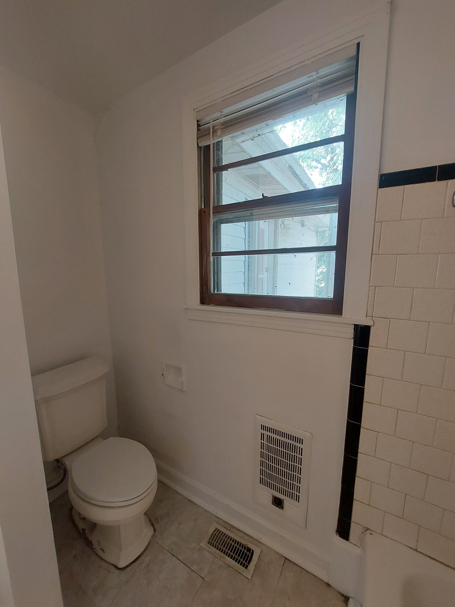 123 McKinley Street Madison, TN 37115 - Photo 8 of 11 a bathroom with a toilet and a window