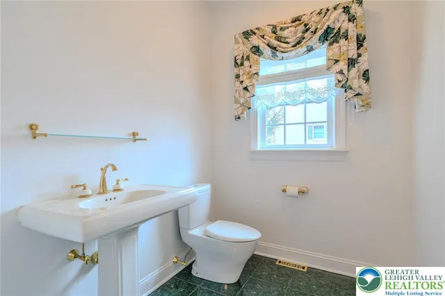 a view of a hallway with wooden floor a fireplace