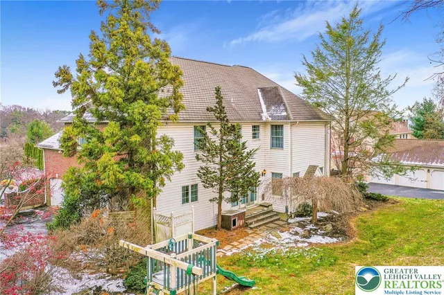 a view of a brick house with outdoor space