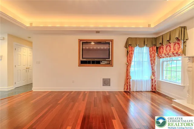 a view of front door with wooden floor