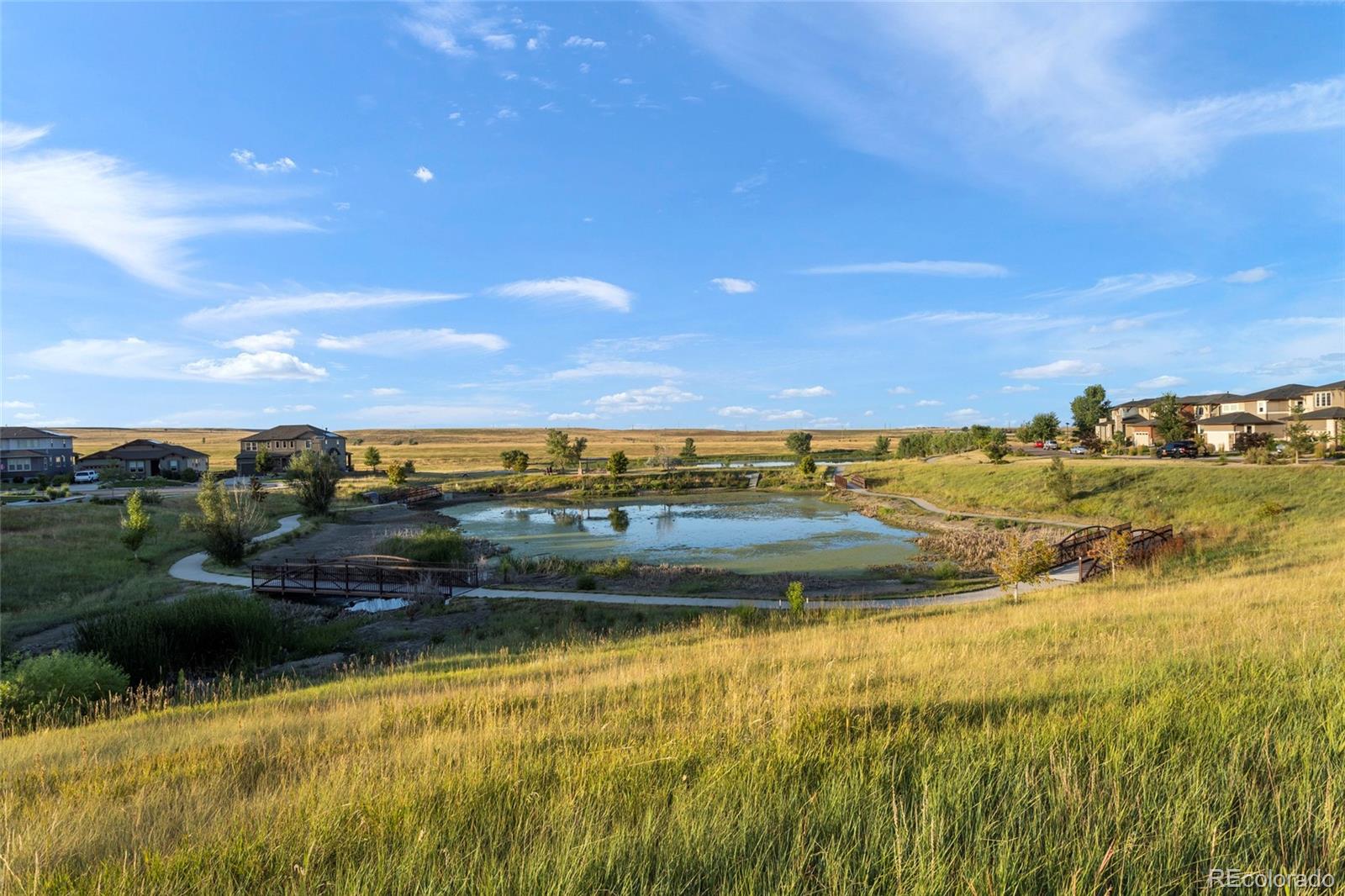 9382 Noble Way Arvada, CO 80007 - Photo 42 of 42 a view of a lake with a houses