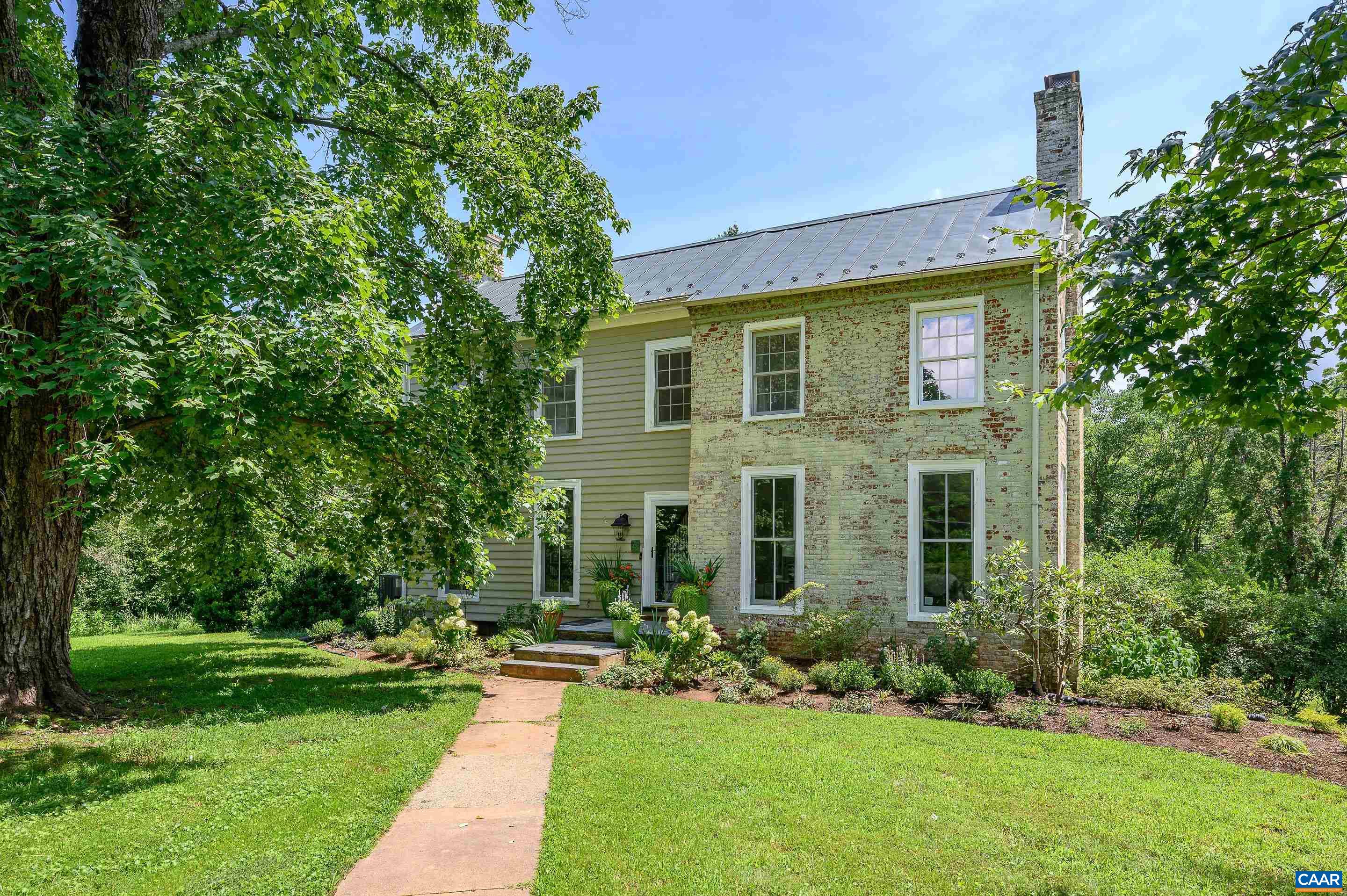 699 Ivy Depot Road Charlottesville, VA 22903 - Photo 1 of 55 a front view of a house with a yard
