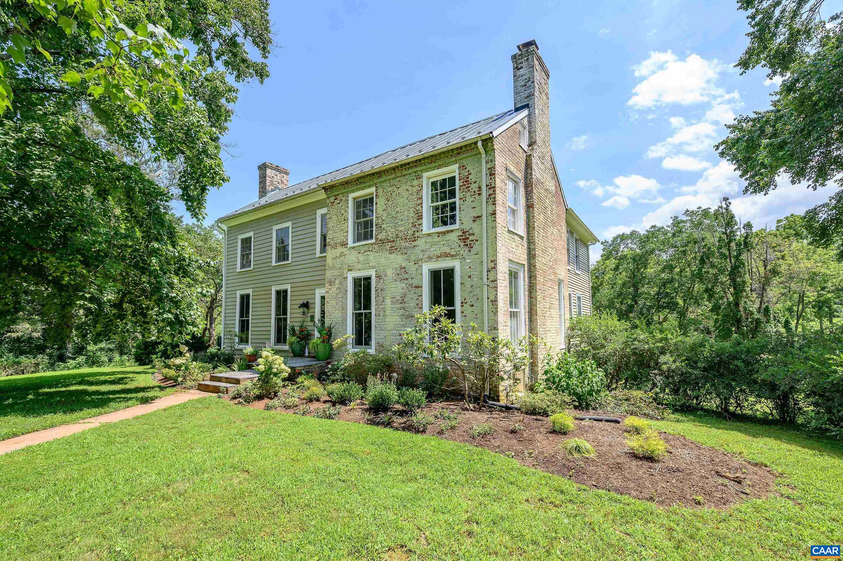 699 Ivy Depot Road Charlottesville, VA 22903 - Photo 2 of 55 a front view of a house with a yard