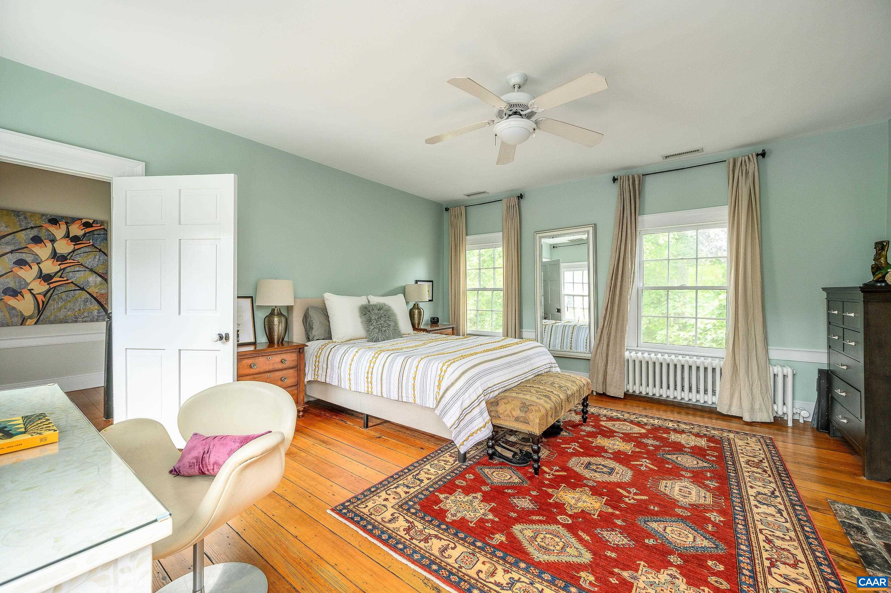 699 Ivy Depot Road Charlottesville, VA 22903 - Photo 22 of 55 a bedroom with a bed and wooden floor