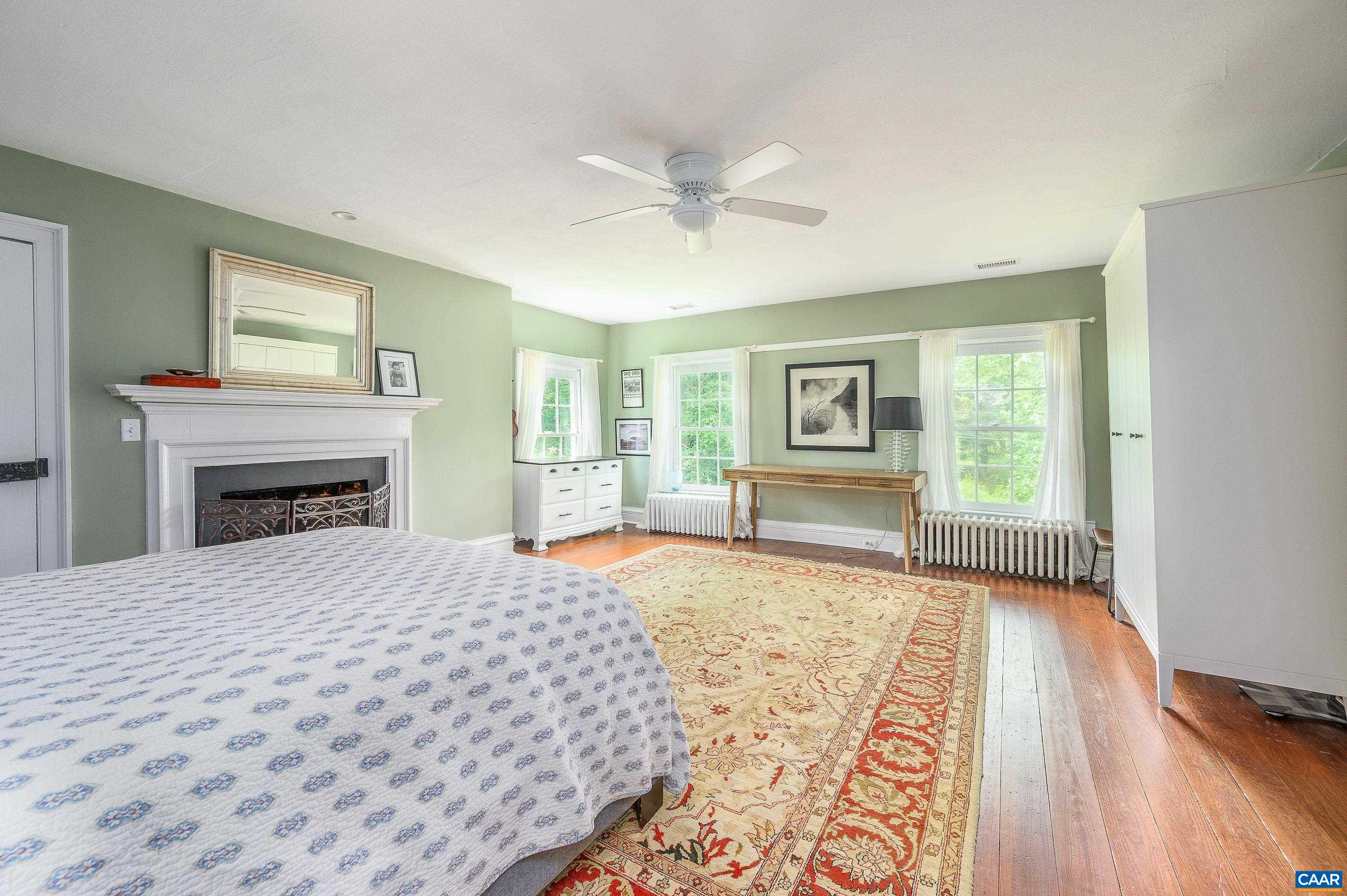 699 Ivy Depot Road Charlottesville, VA 22903 - Photo 24 of 55 a bedroom with a large bed and a window