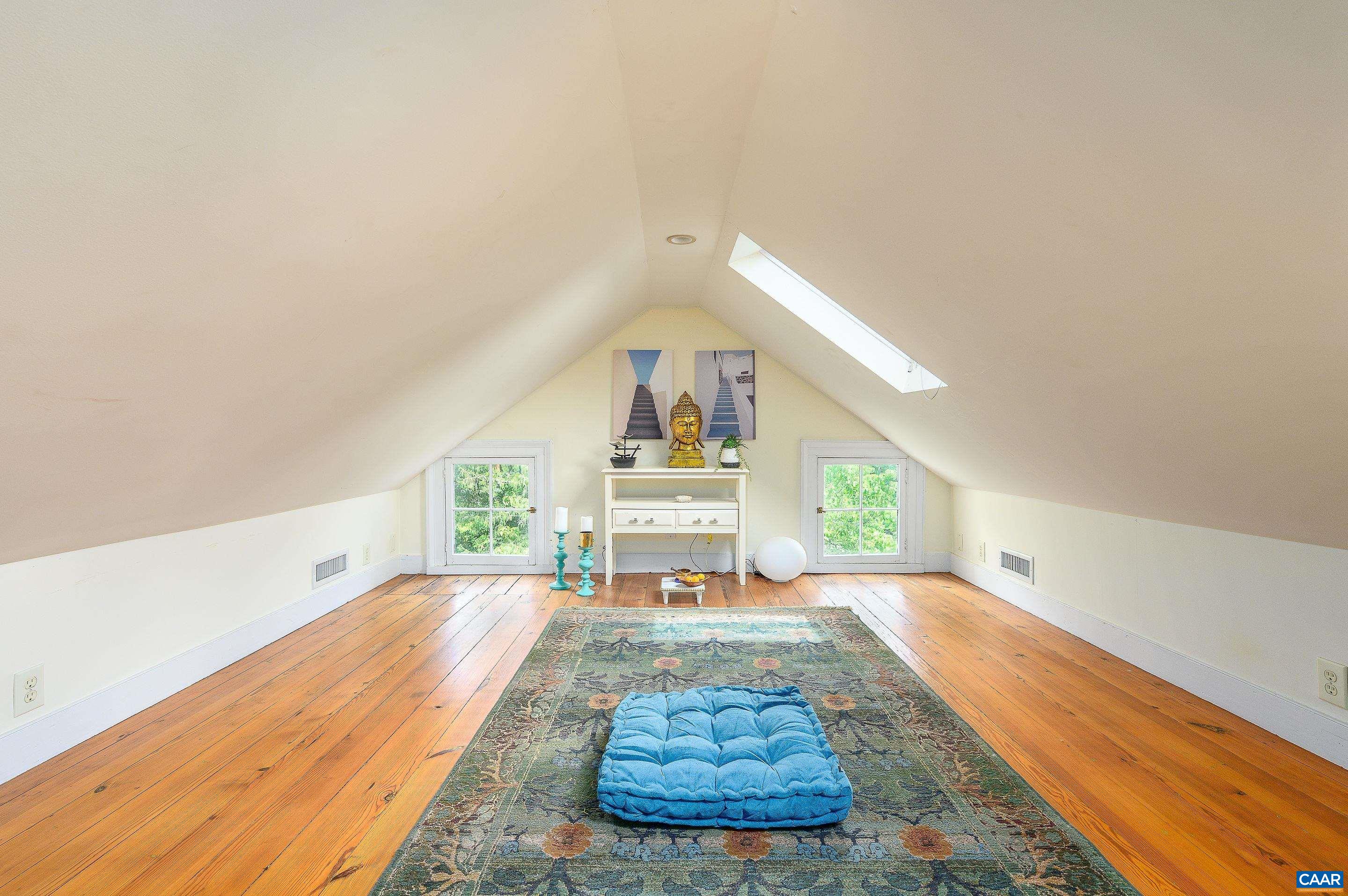 699 Ivy Depot Road Charlottesville, VA 22903 - Photo 30 of 55 a view of a livingroom with wooden floor and a rug