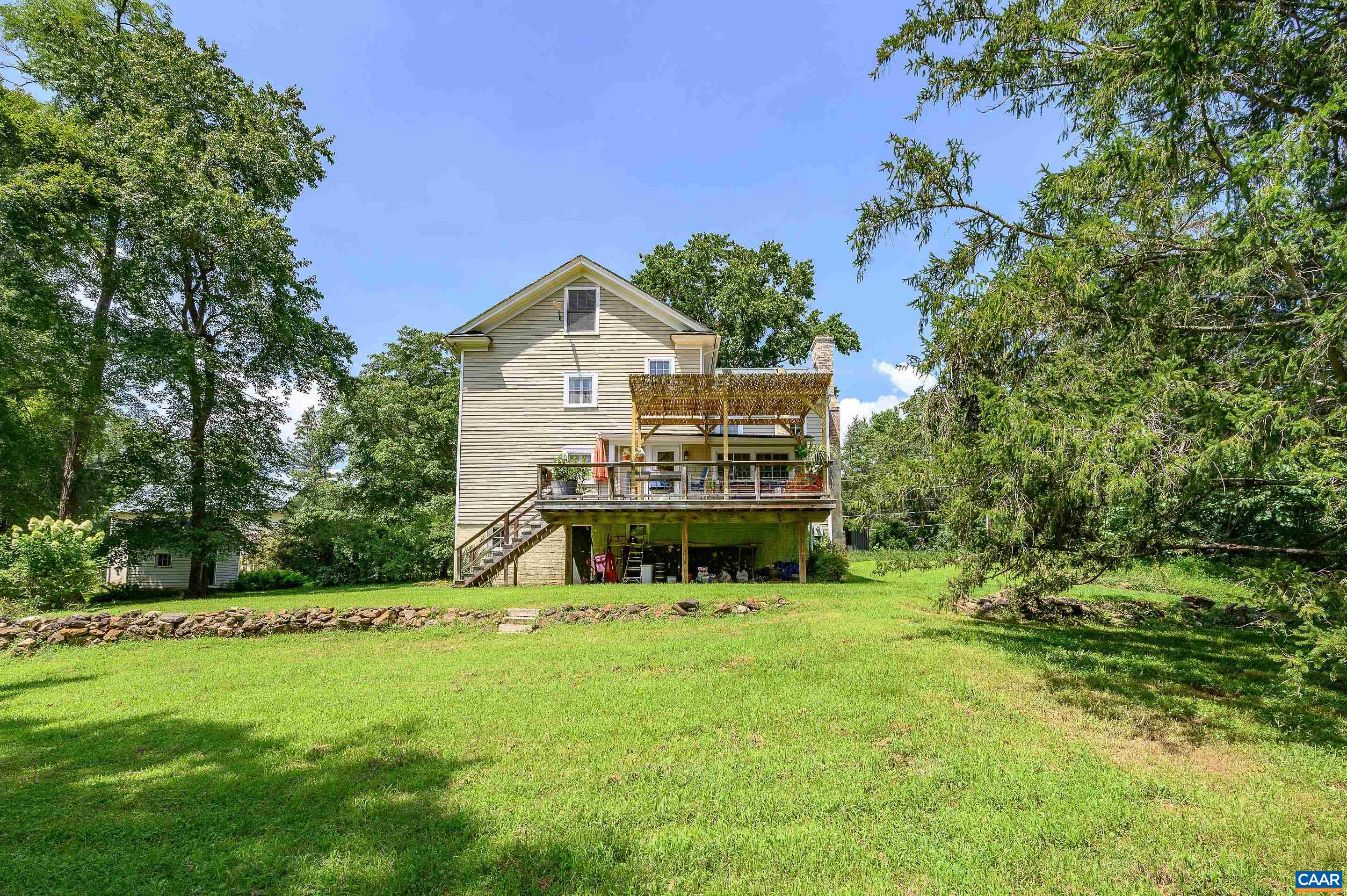 699 Ivy Depot Road Charlottesville, VA 22903 - Photo 34 of 55 a view of a house with a big yard and large trees