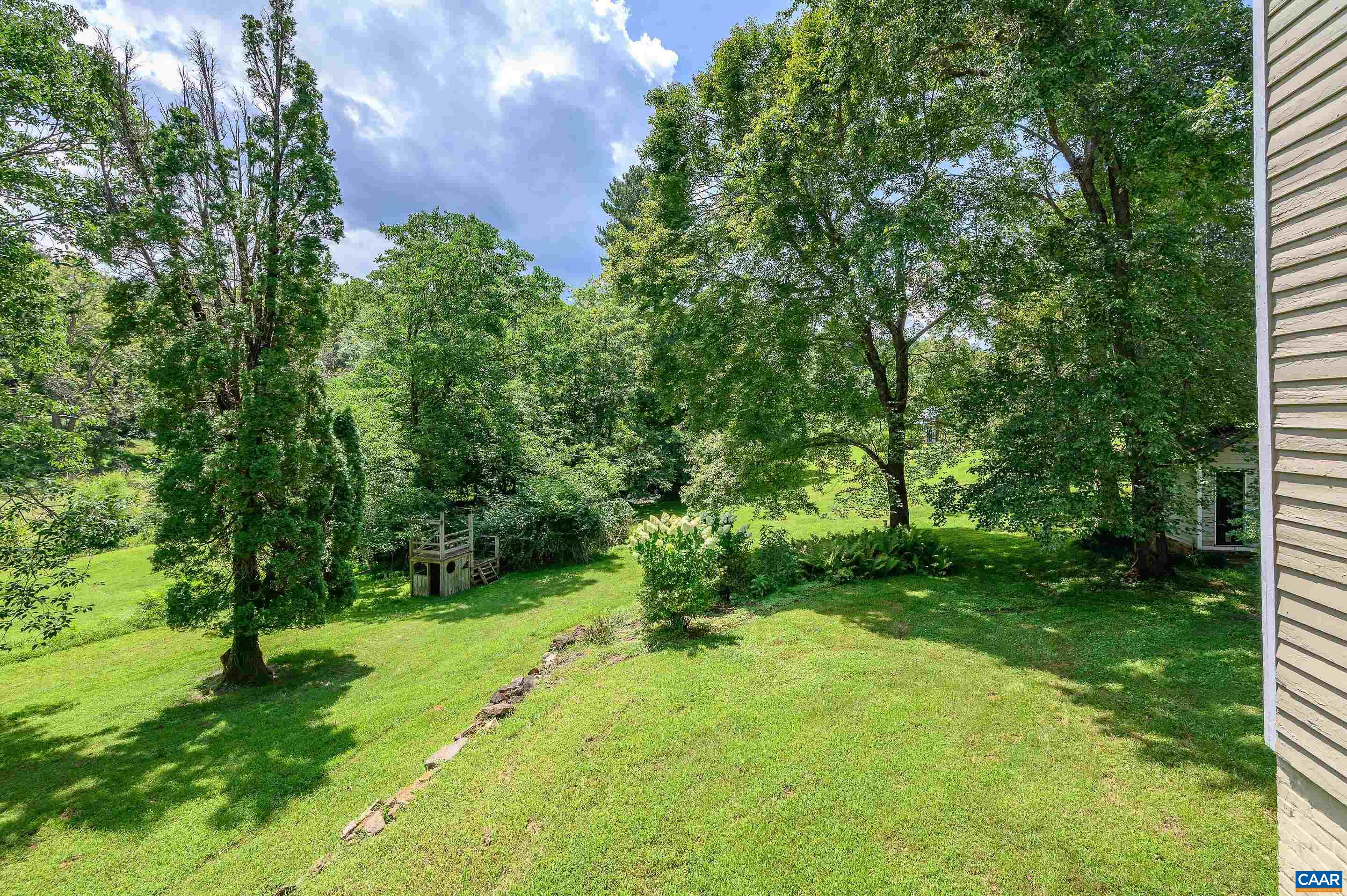 699 Ivy Depot Road Charlottesville, VA 22903 - Photo 36 of 55 a backyard of a house with lots of green space