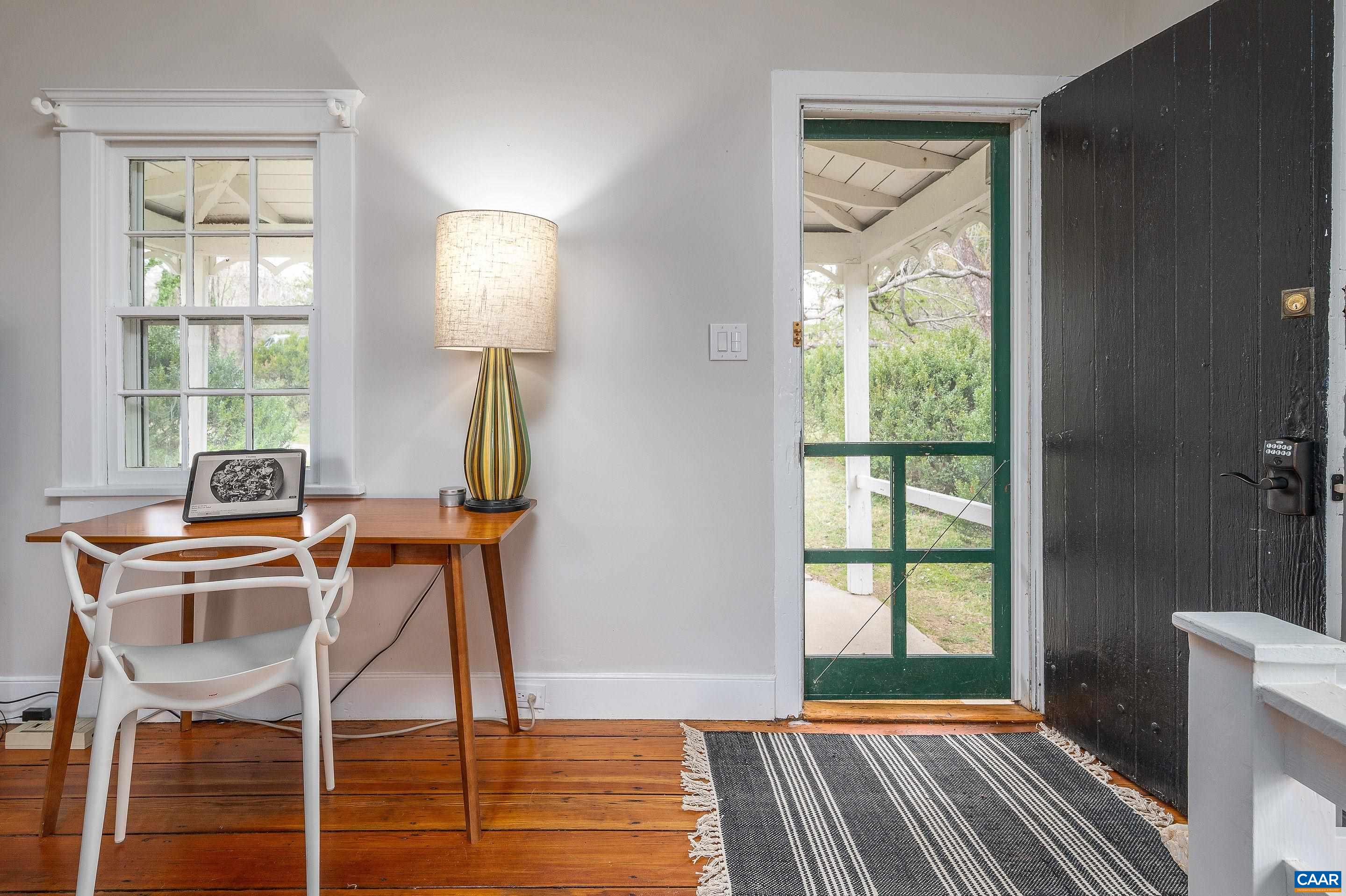 699 Ivy Depot Road Charlottesville, VA 22903 - Photo 41 of 55 a room that has a window and a table in it