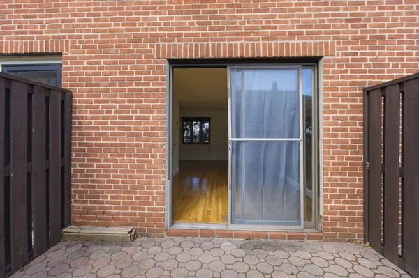 a view of a wooden door of the house