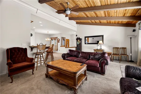 a kitchen with stainless steel appliances granite countertop a sink a stove a microwave and wooden cabinets