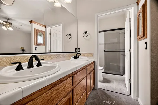 a view of living room kitchen with furniture and flat screen tv
