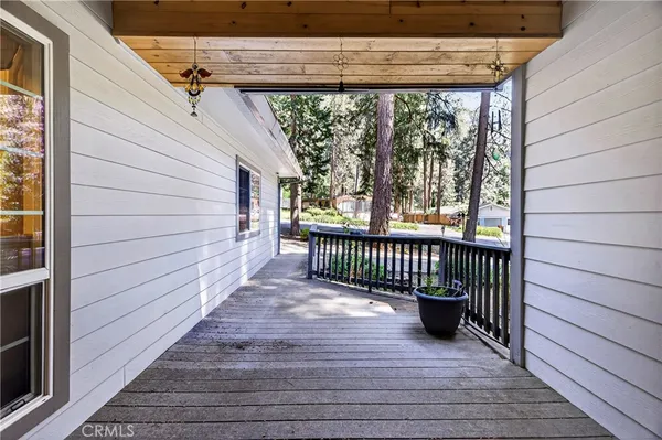 a view of a porch with wooden floor
