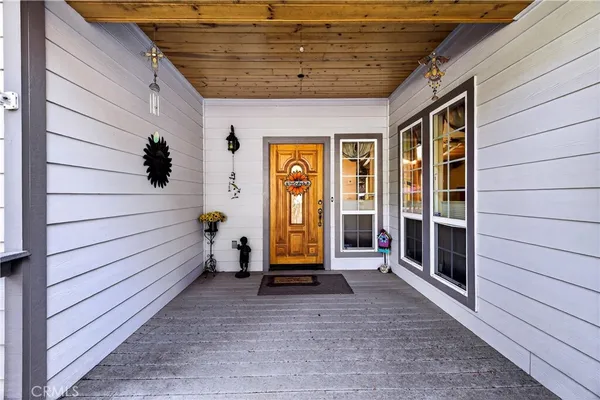 a view of front door with wooden floor