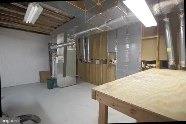 a kitchen with a refrigerator and a sink