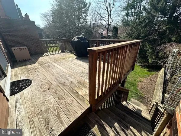 a view of balcony with wooden floor