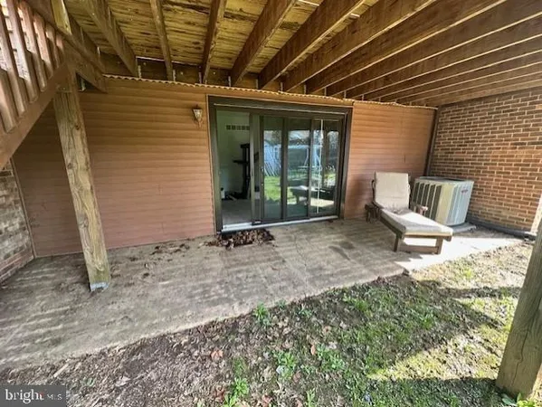 a view of a backyard with a patio