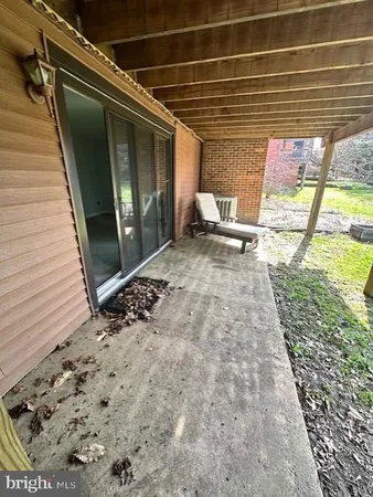 a view of sitting area in front of house
