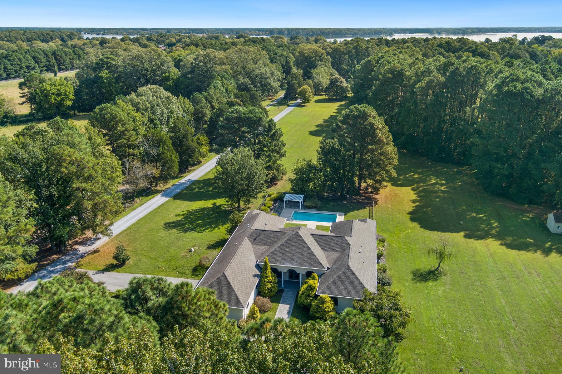 9171 Deepwater Point Road St. Michaels, MD 21663 - Photo 1 of 40 an aerial view of a house with a yard