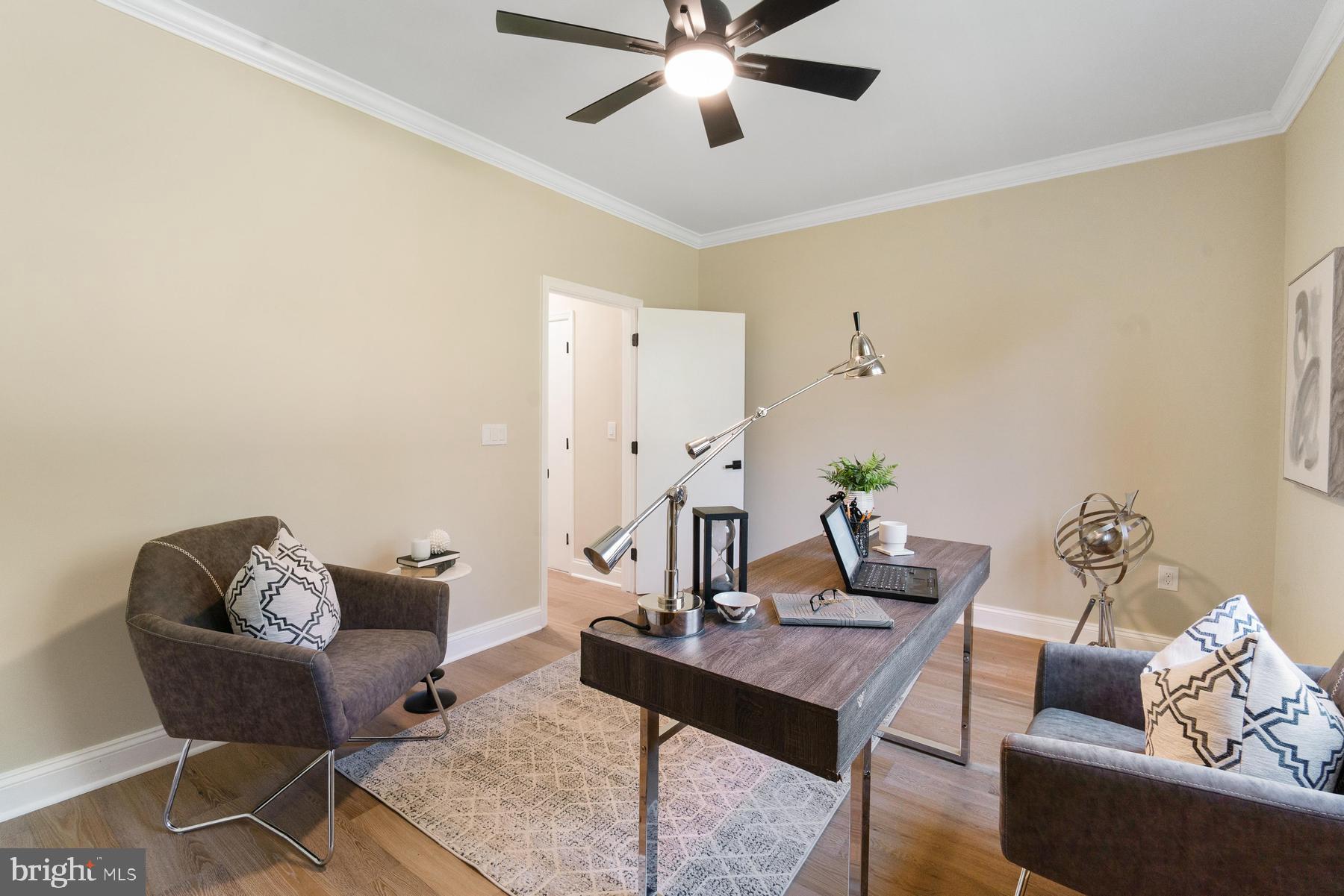 9171 Deepwater Point Road St. Michaels, MD 21663 - Photo 16 of 40 a living room with furniture and a table