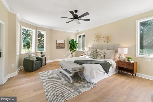 a spacious bedroom with a bed and a couch