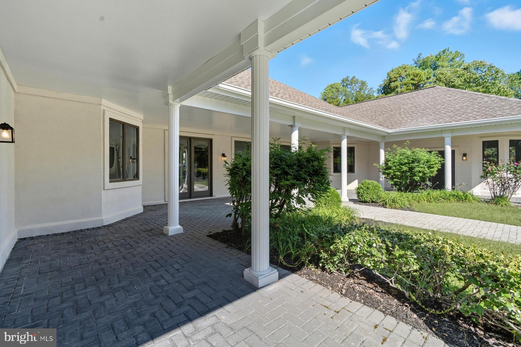 9171 Deepwater Point Road St. Michaels, MD 21663 - Photo 29 of 40 front view of a house with a yard