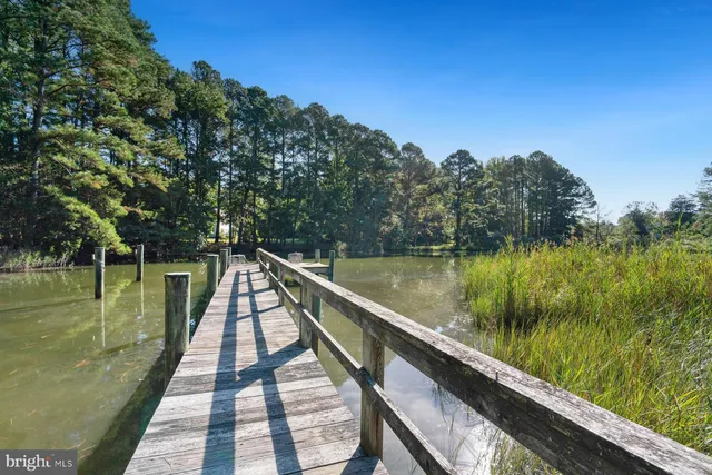 a view of a lake with a yard