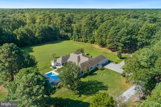 an aerial view of a house with garden