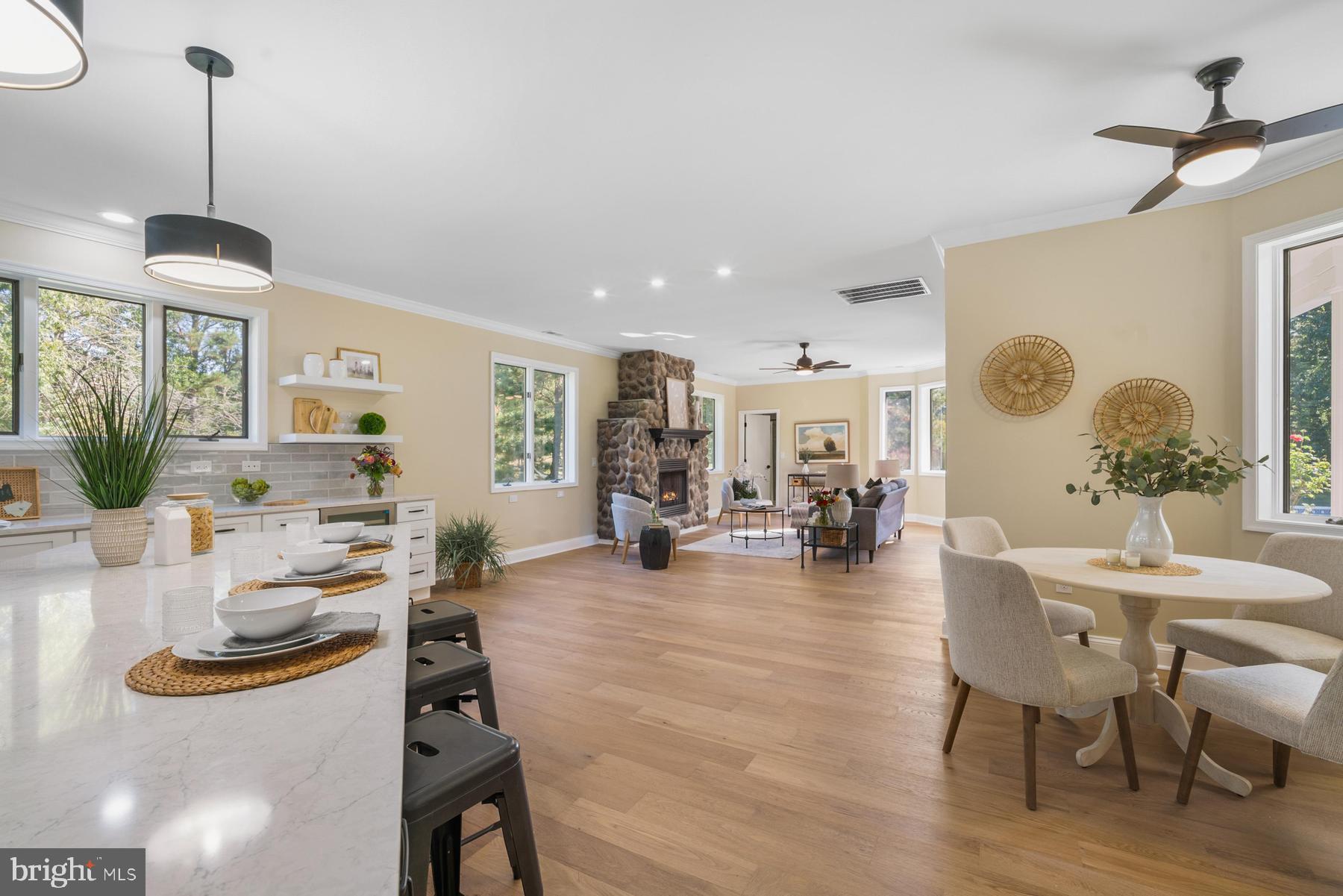 9171 Deepwater Point Road St. Michaels, MD 21663 - Photo 10 of 40 a living room with furniture and wooden floor
