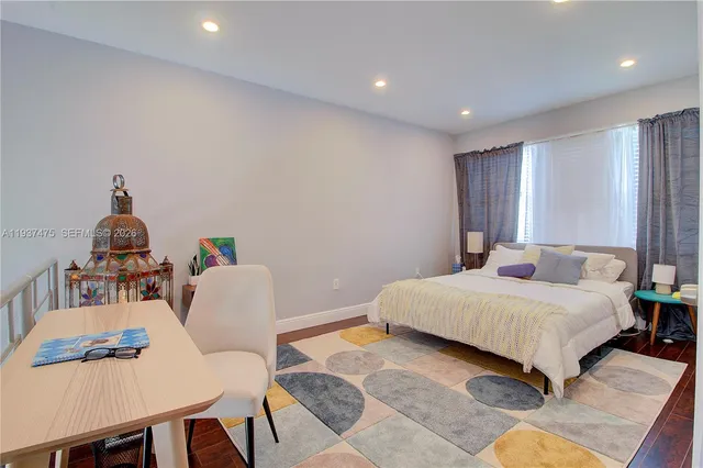 a hallway with table and chairs