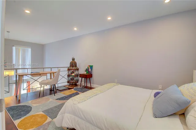 a bathroom with a toilet a sink and shower