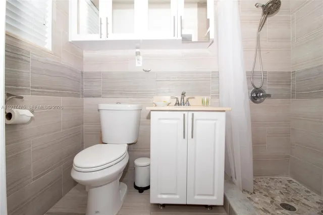 a view of swimming pool with outdoor seating and deck