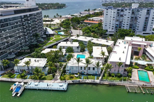an aerial view of a house with a lake view