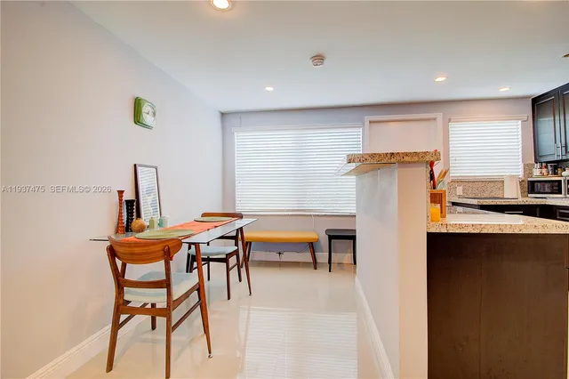 a kitchen with stainless steel appliances a sink stove and refrigerator