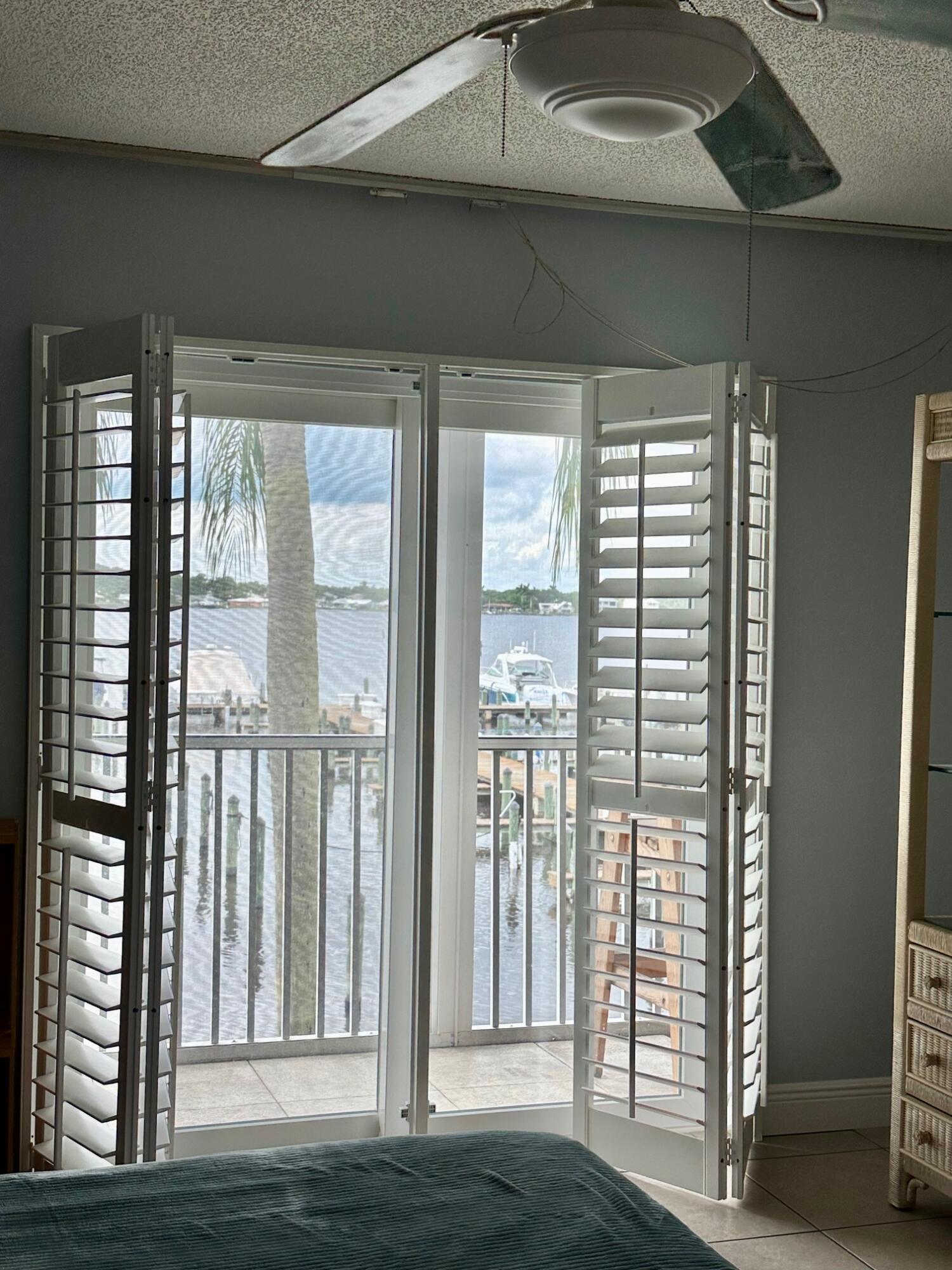 1868 Southwest Palm City Road, Unit 202 Stuart, FL 34994 - Photo 13 of 18 a view of front door and wooden floor