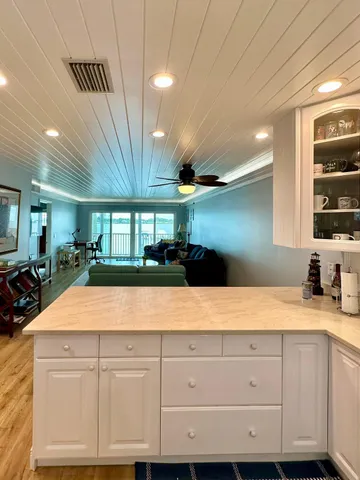 a kitchen with granite countertop a sink and a stove