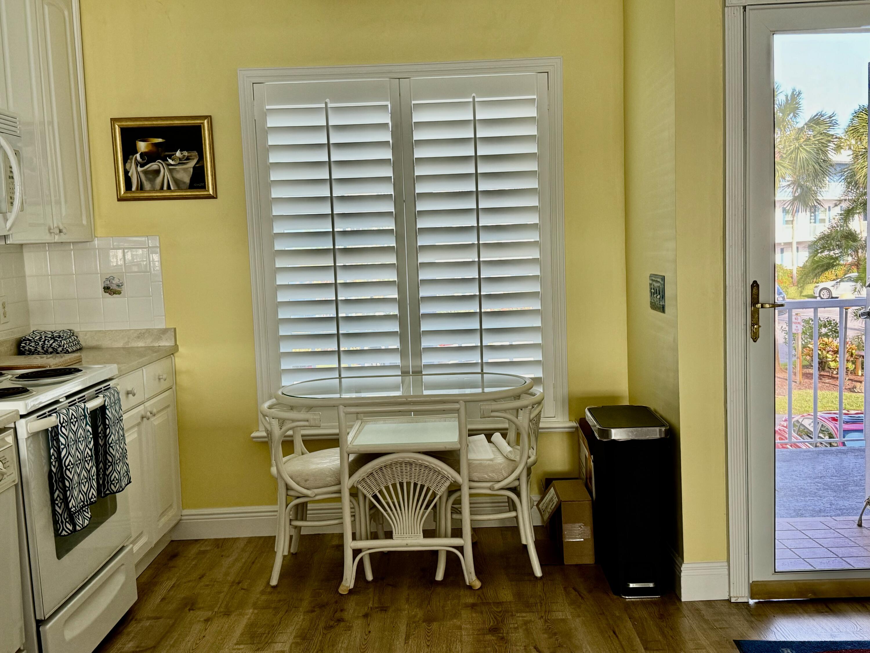1868 Southwest Palm City Road, Unit 202 Stuart, FL 34994 - Photo 10 of 18 a dining room with furniture and a window