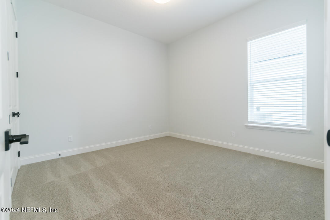531 Eagle Moon Lake Drive St. Augustine, FL 32092 - Photo 24 of 36 an empty room with a window