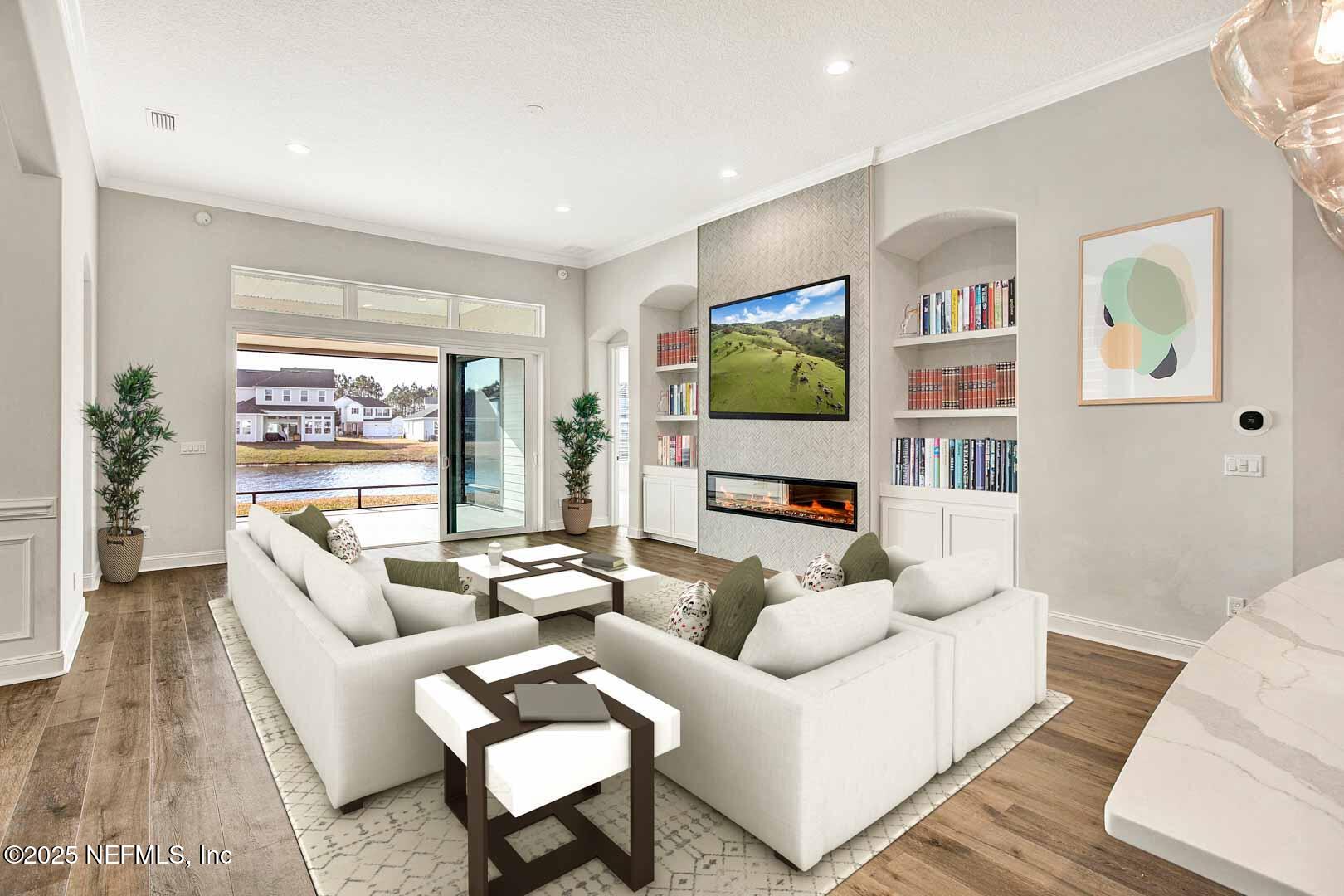 531 Eagle Moon Lake Drive St. Augustine, FL 32092 - Photo 36 of 36 a living room with furniture and a flat screen tv