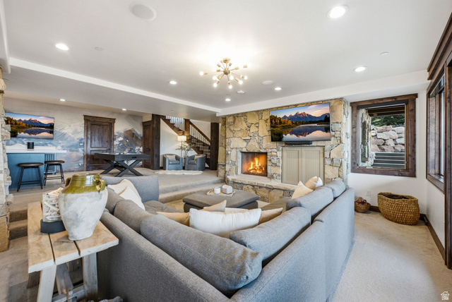 7885 North Rabbitbrush Court, Unit 13 Park City, UT 84098 - Photo 39 of 88 Spacious living area featuring a floor-to-ceiling stone fireplace, built-in media center, and recessed lighting